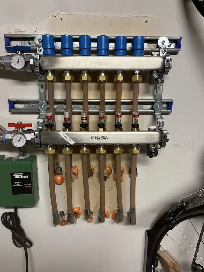 Plumber performing Water Heater Repair at a residential property in St. James